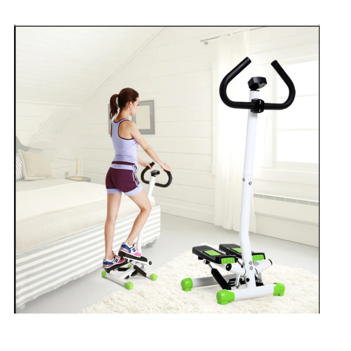 Woman using mini stepper in bedroom – rear view